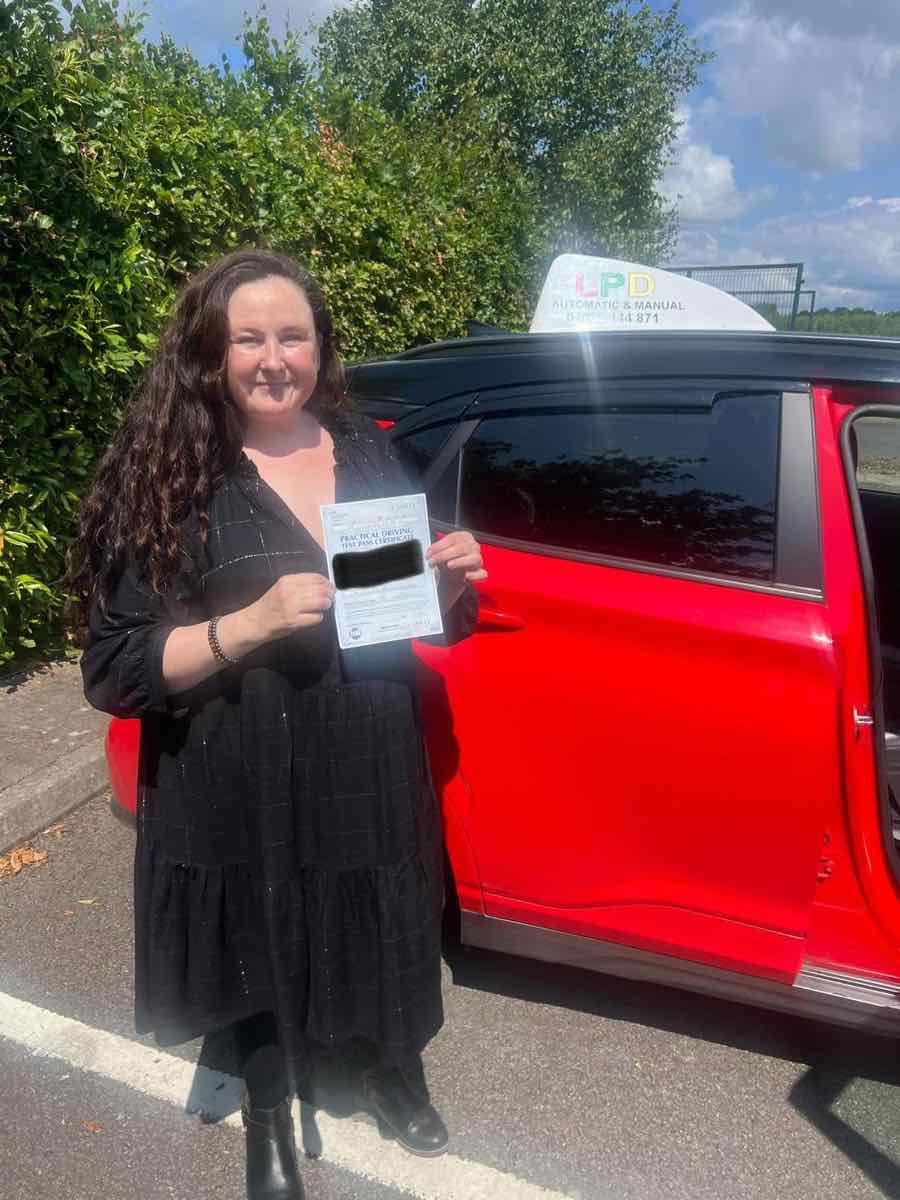 Student celebrating a driving test pass with LPD Driving School